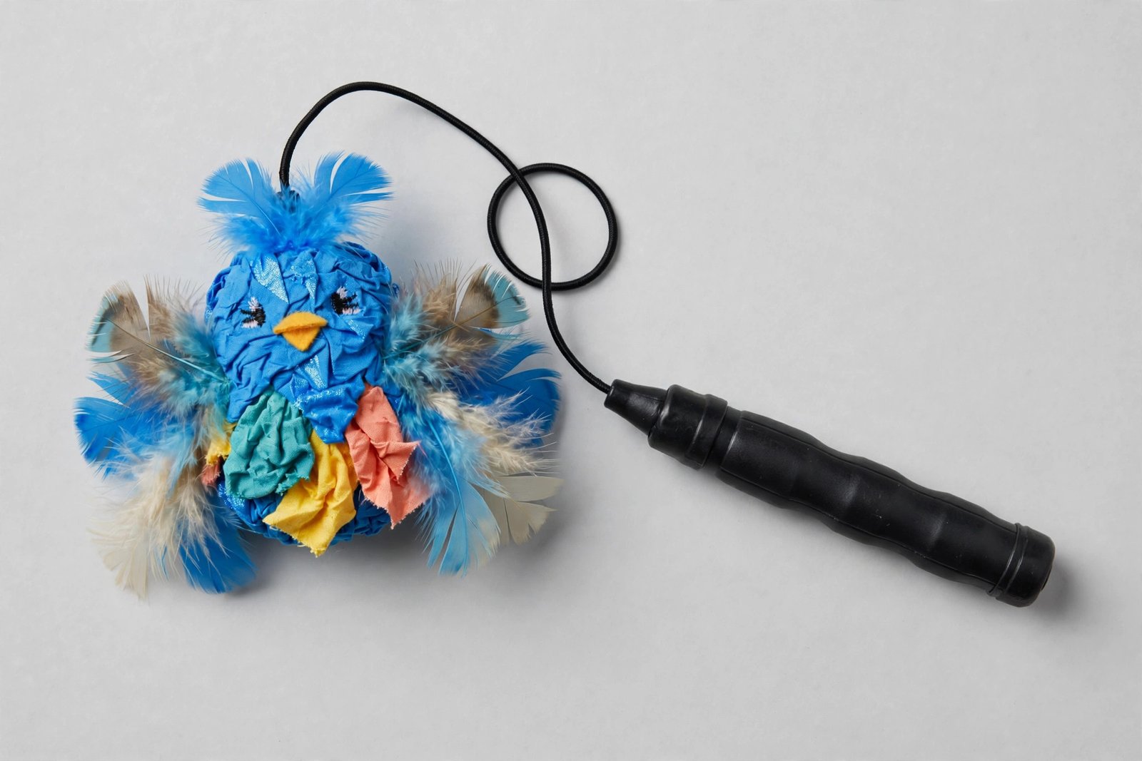 KONG feather teaser wand with a bright bluebird feather character lure on elastic thread