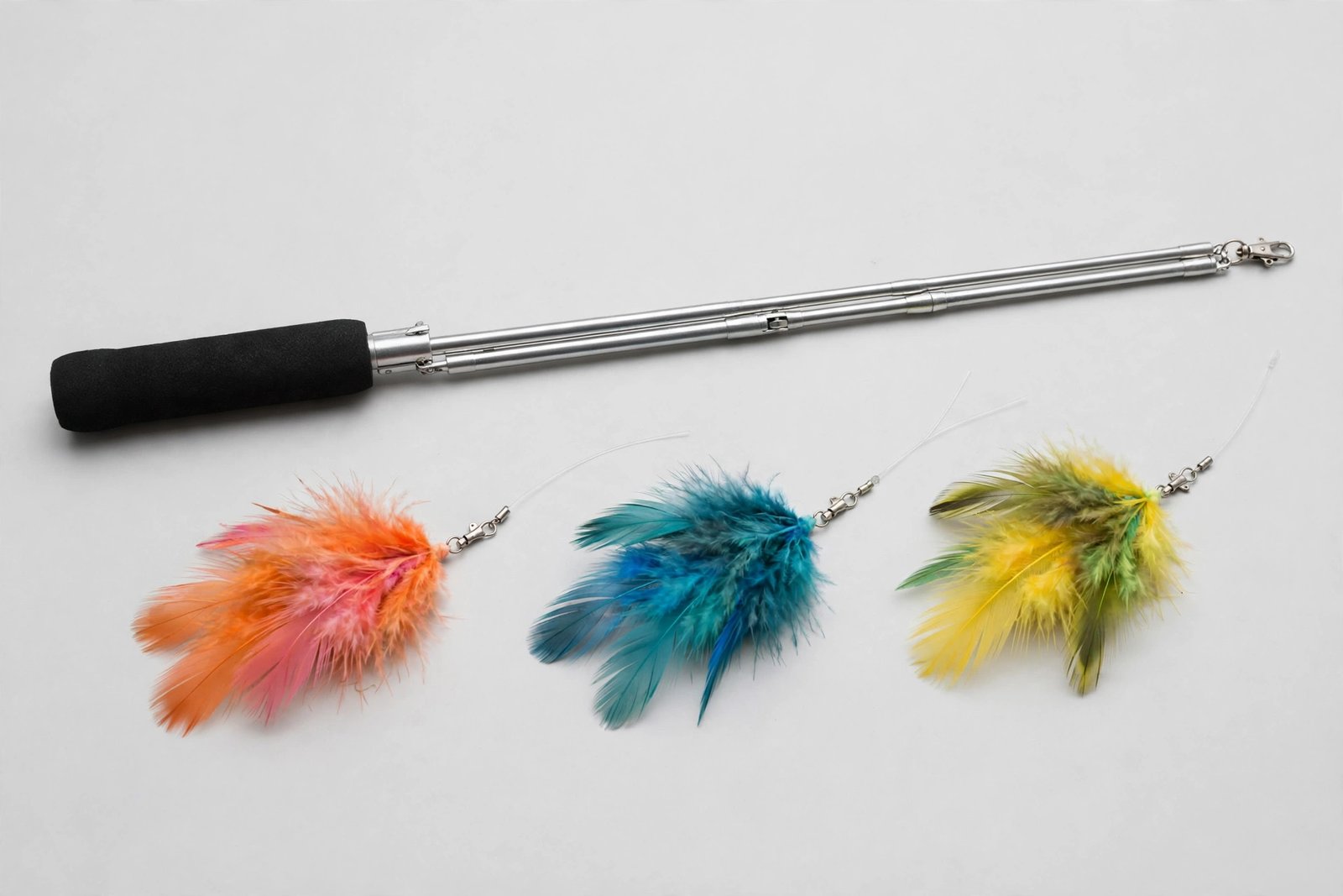 Telescoping cat feather wand with foam handle and three interchangeable feather attachments