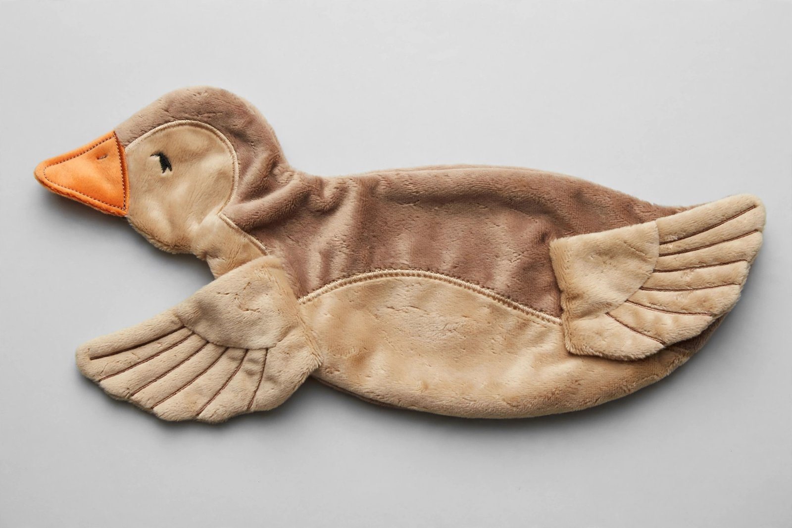 Soft brown and tan plush duck dog toy with no squeakers